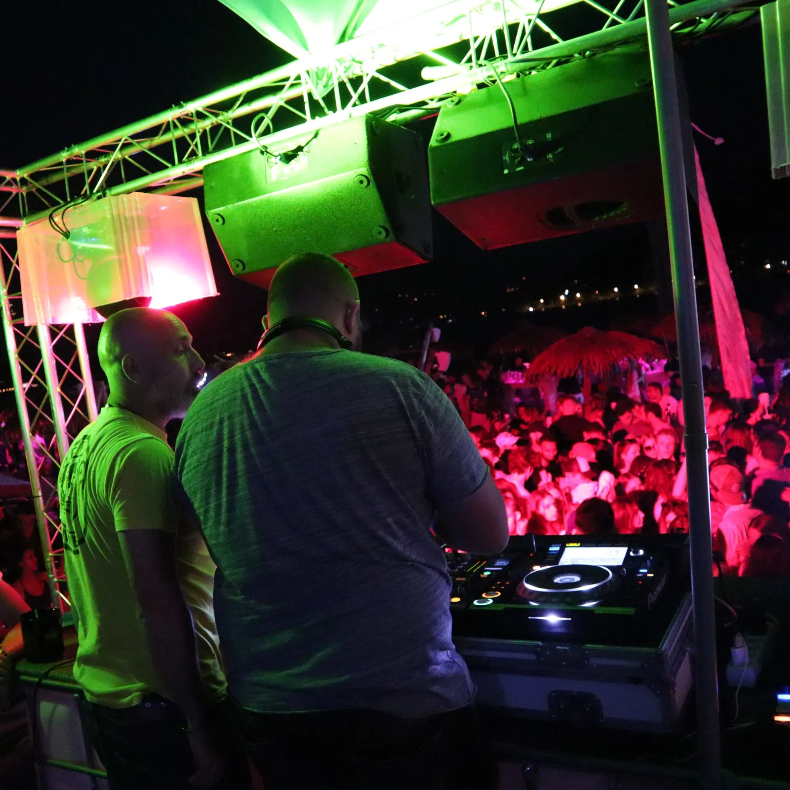 Dualitic in the DJ booth in front of a crowd